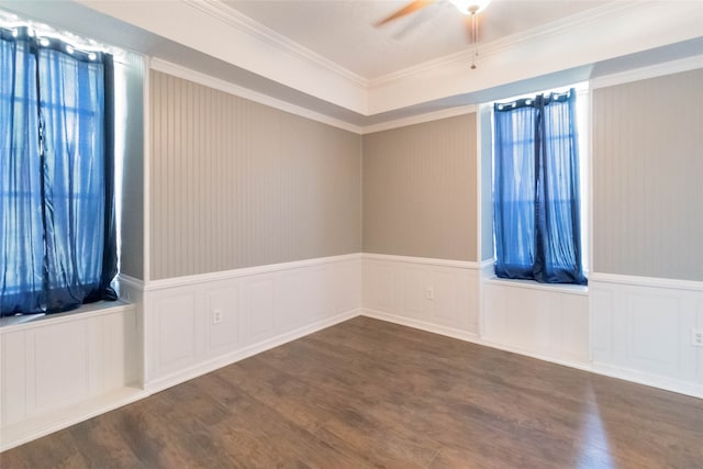 spare room with ceiling fan, dark hardwood / wood-style flooring, and crown molding