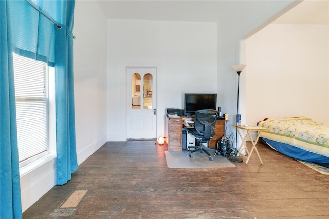 home office with hardwood / wood-style flooring