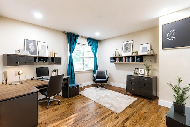 office with hardwood / wood-style flooring