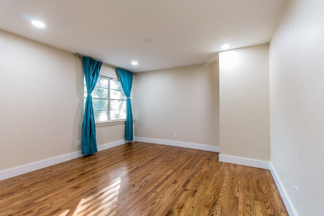 empty room featuring hardwood / wood-style floors