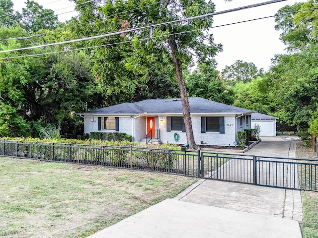 ranch-style house with a garage and a front yard