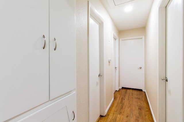 hall with light hardwood / wood-style floors