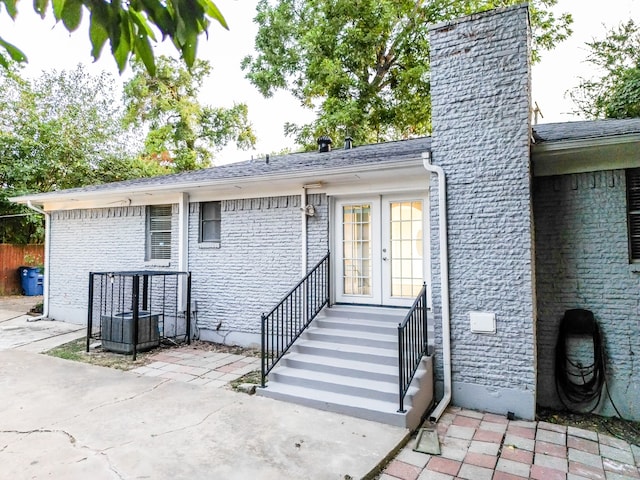 rear view of property featuring a patio and french doors