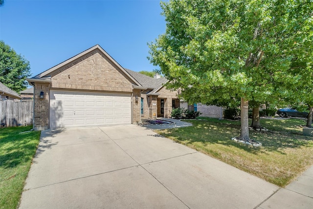 view of front of home featuring a front lawn and a garage