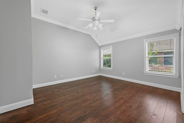 empty room featuring hardwood / wood-style floors, lofted ceiling, ornamental molding, and ceiling fan