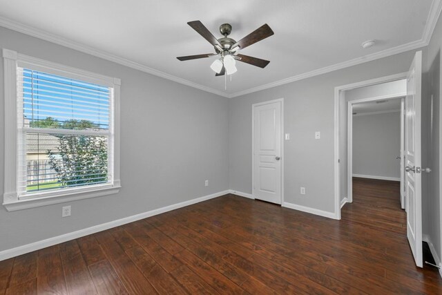 unfurnished bedroom featuring ceiling fan, wood-type flooring, and ornamental molding