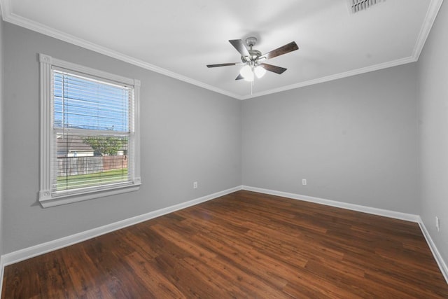 empty room with hardwood / wood-style floors, ornamental molding, and ceiling fan