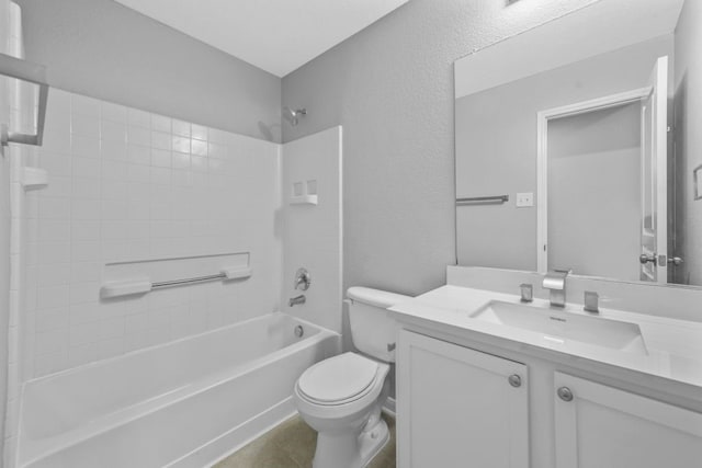 full bathroom with toilet, tile patterned floors, vanity, and tiled shower / bath