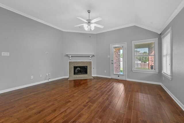 unfurnished living room with ceiling fan, vaulted ceiling, hardwood / wood-style floors, and crown molding