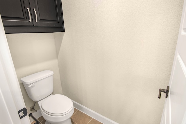 bathroom featuring tile patterned flooring and toilet