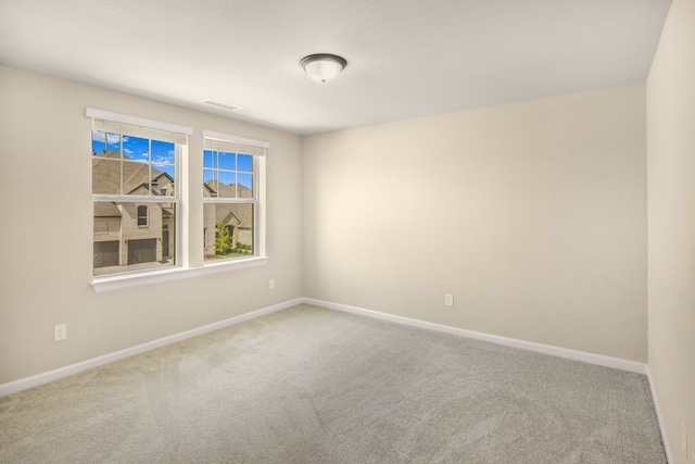 spare room featuring carpet