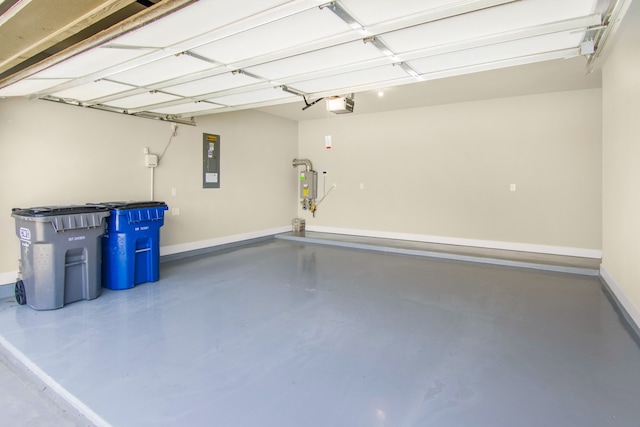 garage featuring a garage door opener and electric panel