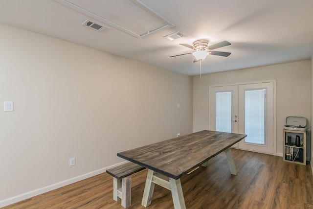 unfurnished dining area with french doors, dark wood finished floors, visible vents, and baseboards