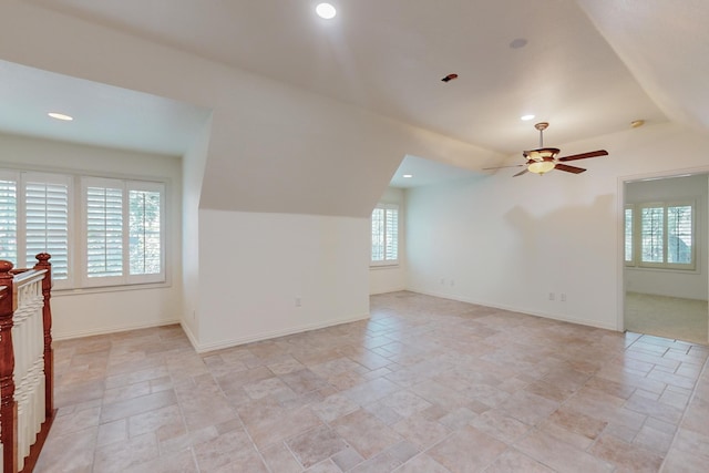 bonus room featuring ceiling fan and plenty of natural light