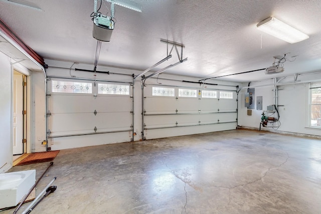 garage featuring a garage door opener and electric panel