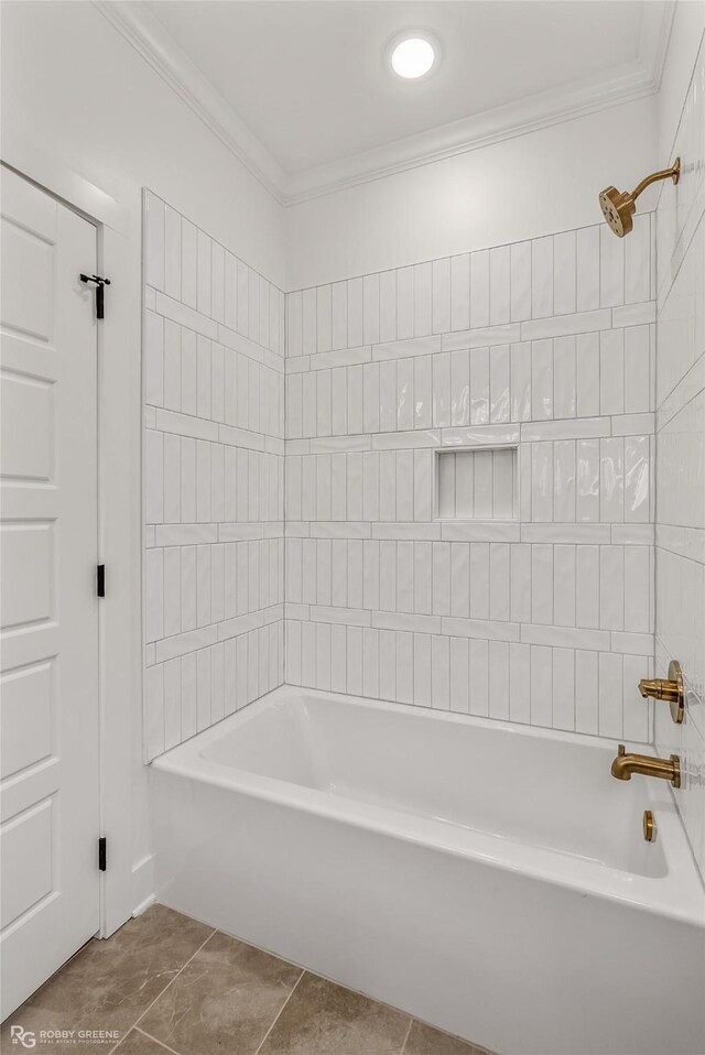 bathroom with tile patterned flooring, ornamental molding, and washtub / shower combination