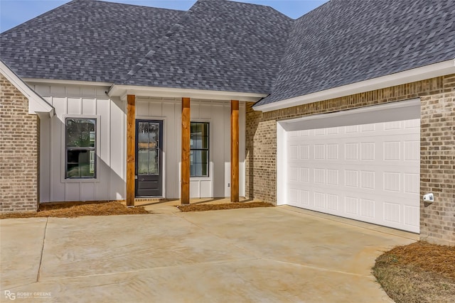 entrance to property featuring a garage and covered porch