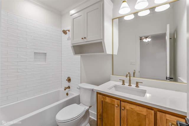 full bathroom with toilet, tiled shower / bath combo, ceiling fan, and vanity