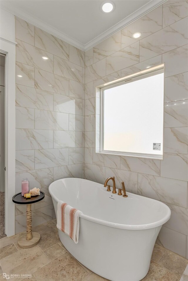 bathroom with a tile shower and ornamental molding