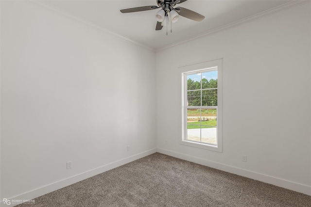 carpeted empty room featuring ornamental molding and ceiling fan