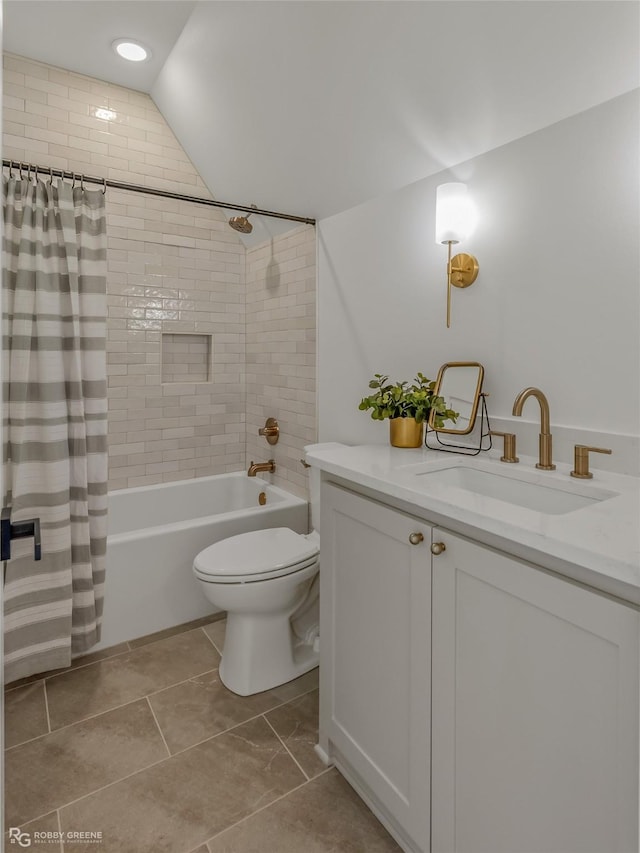 full bathroom featuring lofted ceiling, vanity, shower / bath combination with curtain, and toilet