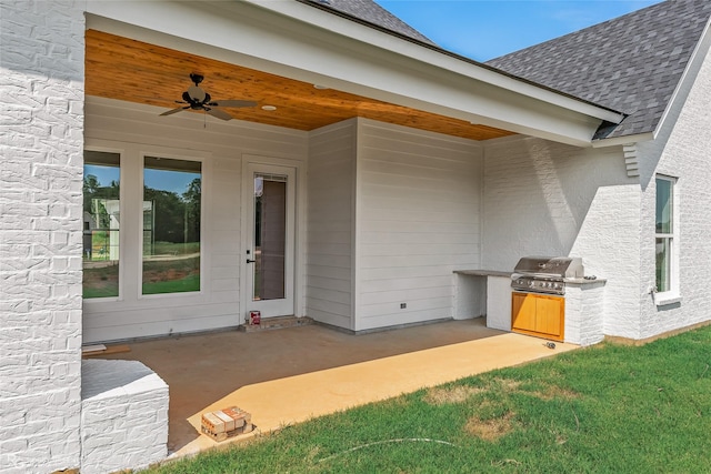 exterior space featuring exterior kitchen, ceiling fan, and grilling area