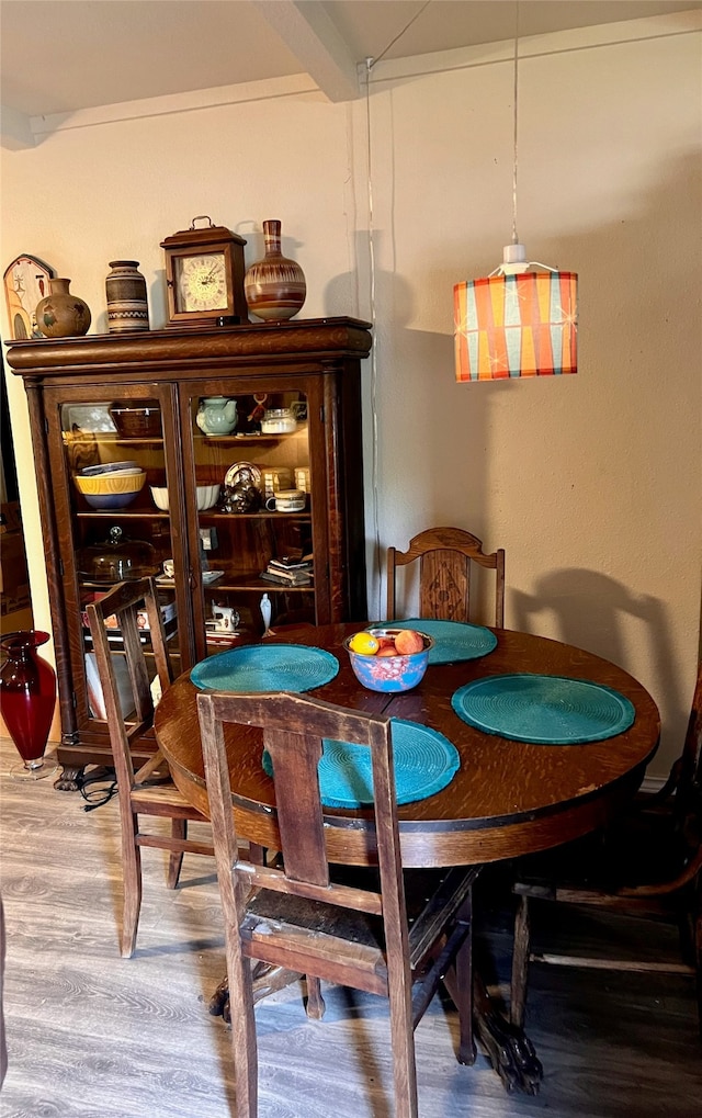 dining area with hardwood / wood-style flooring