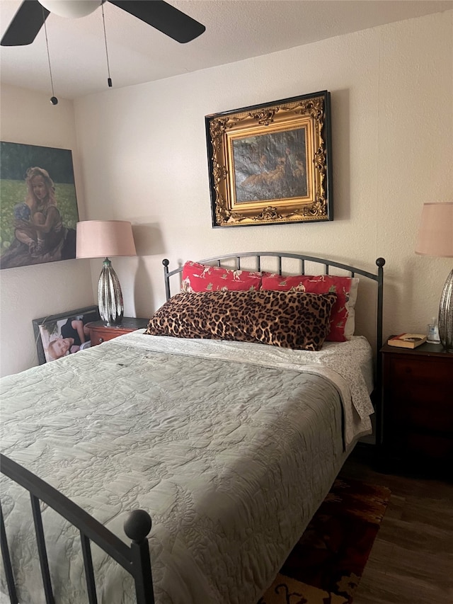 bedroom featuring dark hardwood / wood-style floors and ceiling fan