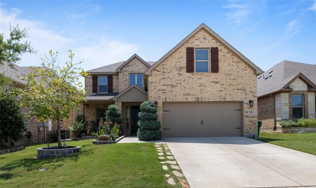 craftsman-style home featuring a front lawn and a garage