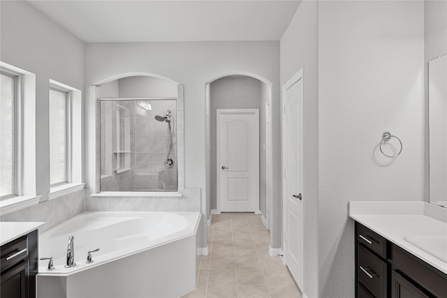 bathroom with vanity, tile patterned floors, and separate shower and tub