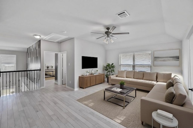 living room with ceiling fan and light wood-type flooring