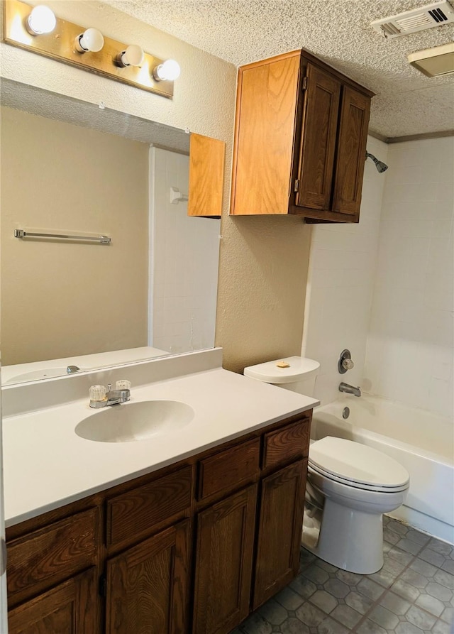 full bathroom featuring vanity, toilet, a textured ceiling, and shower / bath combination