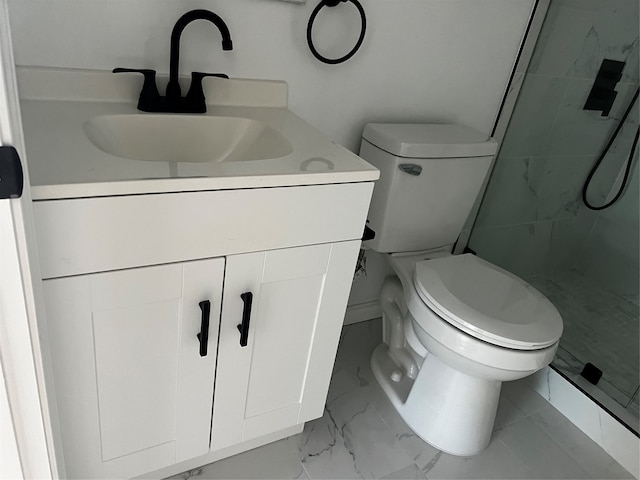 bathroom featuring a tile shower, toilet, tile patterned floors, and vanity