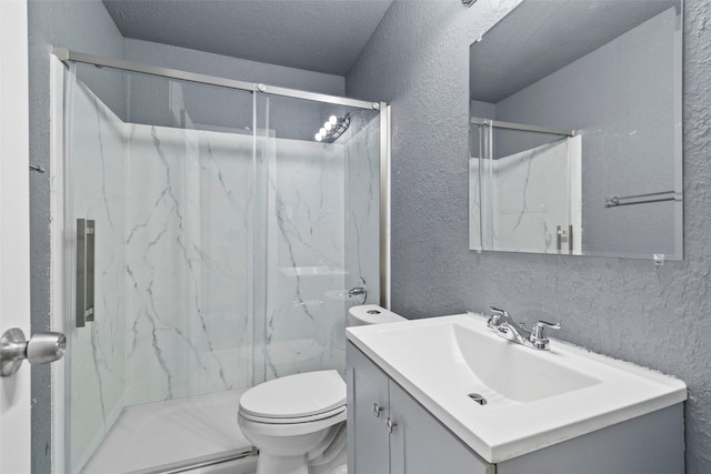 full bathroom with toilet, a textured ceiling, a marble finish shower, vanity, and a textured wall