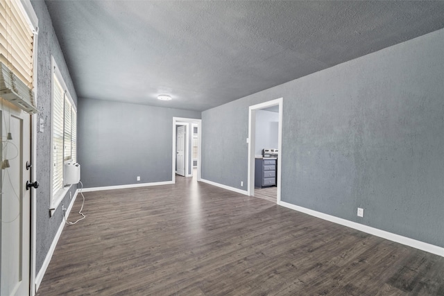 interior space featuring a textured ceiling and hardwood / wood-style flooring