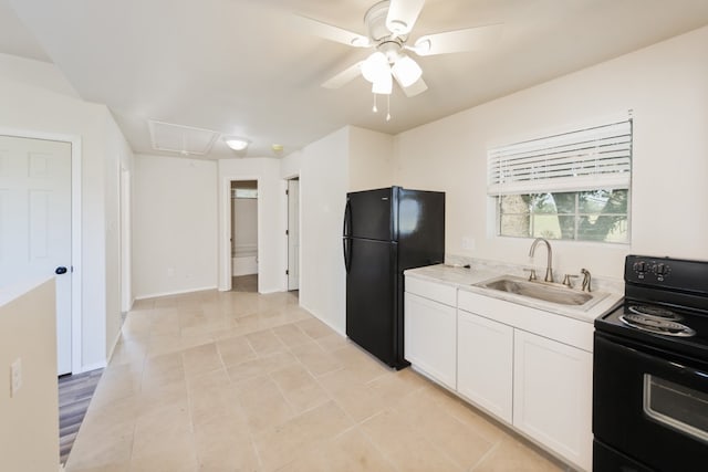 kitchen with sink, black appliances, ceiling fan, light tile patterned floors, and white cabinets