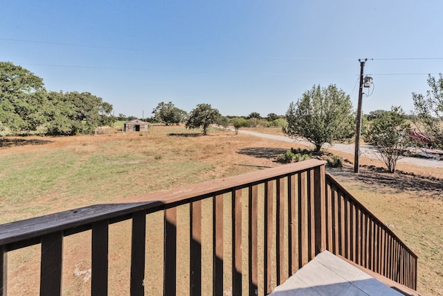 wooden terrace with a rural view