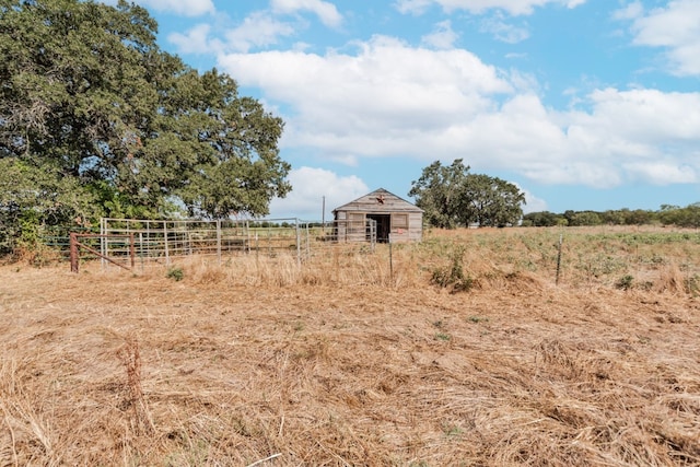 view of yard with a rural view