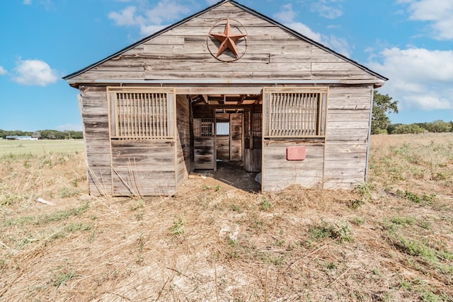 view of outdoor structure featuring a rural view