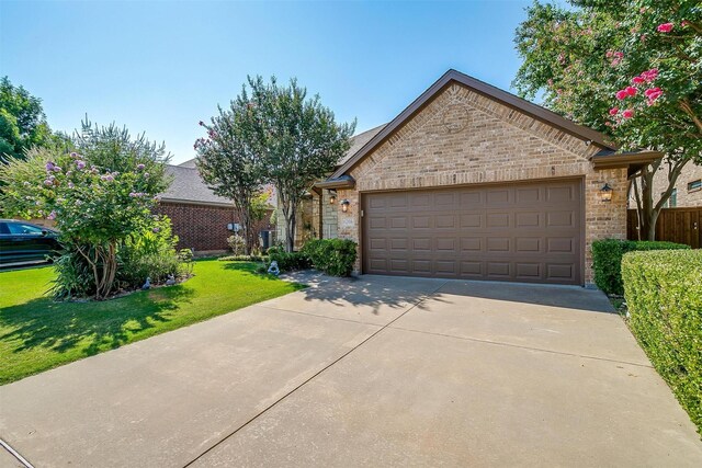 view of front of house with a front lawn and a garage