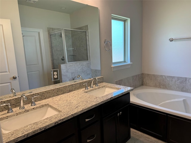 bathroom featuring vanity and shower with separate bathtub