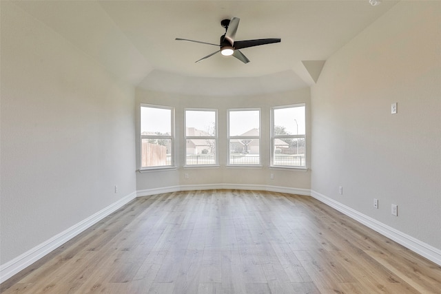 empty room featuring ceiling fan and light hardwood / wood-style floors