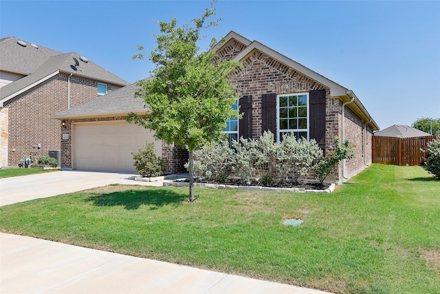 view of front facade featuring a garage and a front lawn