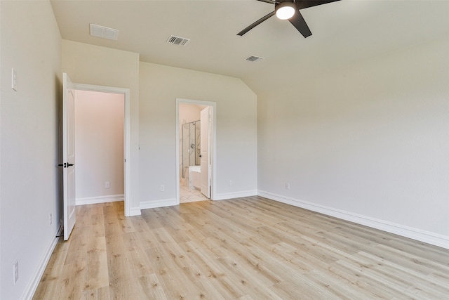 unfurnished bedroom with ceiling fan, light hardwood / wood-style flooring, and connected bathroom