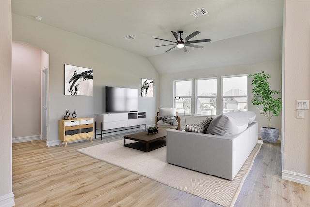 living room featuring vaulted ceiling, ceiling fan, and light hardwood / wood-style floors