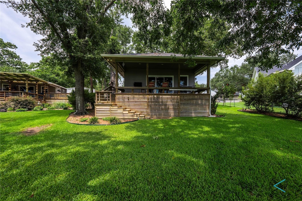 back of property with a yard