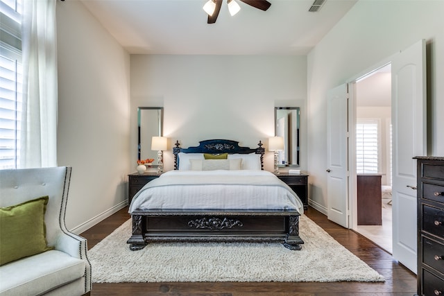 bedroom with ceiling fan and dark hardwood / wood-style flooring