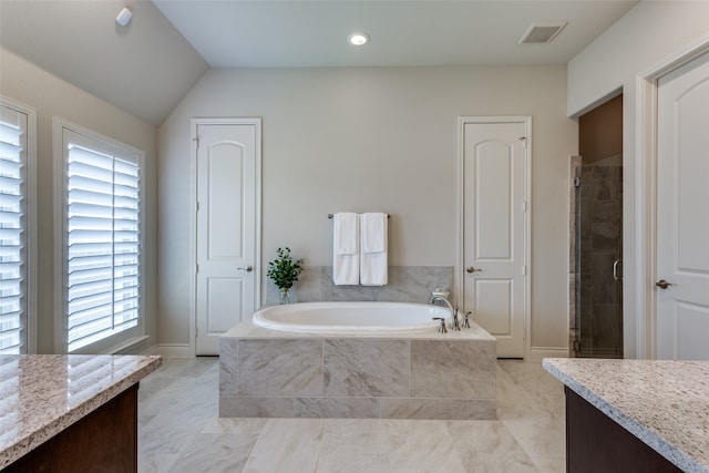 bathroom with shower with separate bathtub, tile patterned floors, vanity, and vaulted ceiling