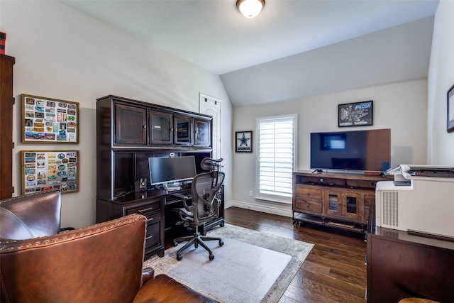 office space with vaulted ceiling, dark wood finished floors, and baseboards