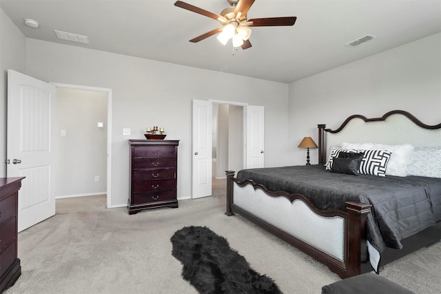 bedroom featuring ceiling fan and light carpet